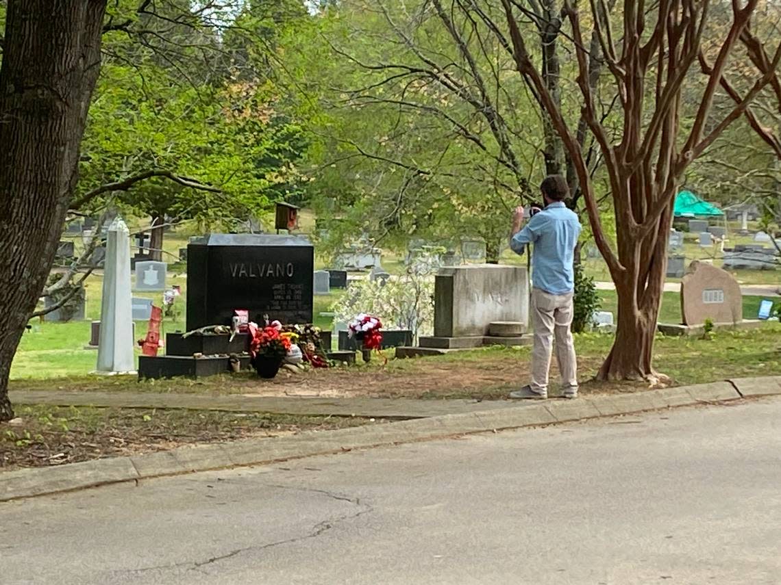 Spencer Mobley of Benson makes a pilgrimage to Jim Valvano’s grave following the Wolfpack’s Final Four run.