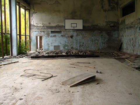 An abandoned basketball court at Pripyat - Credit: getty