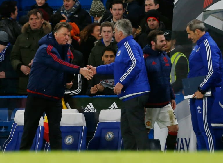 Manchester United's manager Louis van Gaal (L) shakes hands with Chelsea's interim manager Guus Hiddink after an English Premier League football match at Stamford Bridge in London on February 7, 2016