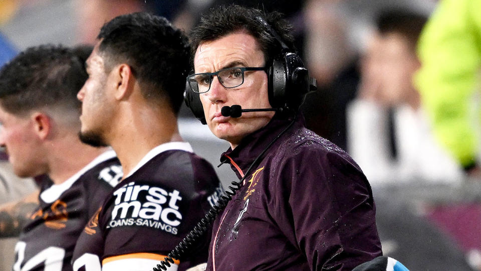 Seen here, Brisbane head of football operations Ben Ikin looks on during an NRL game. 