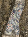 A view of a well-preserved colorful mosaic floor of an ancient Roman villa archaeologists have revealed among vineyards near the northern city of Verona, Italy. The official in charge of archaeology Verona province, Gianni De Zuccato, on Friday, May 29, 2020, said the mosaics appeared to be ‘’in a good state of conservation,’’ from what they are able to observe after gingerly digging a trench between vineyards in the hills of Valpolicella, known for its full-bodied red wine. (Soprintendenza ABAP Verona via AP)