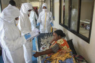 Doctors tend to a patient suffering from COVID-19 and receiving oxygen, in a ward for coronavirus patients at the Martini hospital in Mogadishu, Somalia Wednesday, Feb. 24, 2021. (AP Photo/Farah Abdi Warsameh)