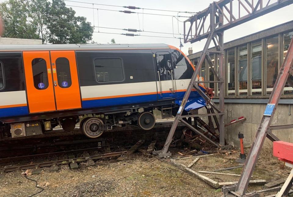 Two people were injured when a train carrying around 50 passengers crashed through buffers at Enfield Town station  (PA Media)