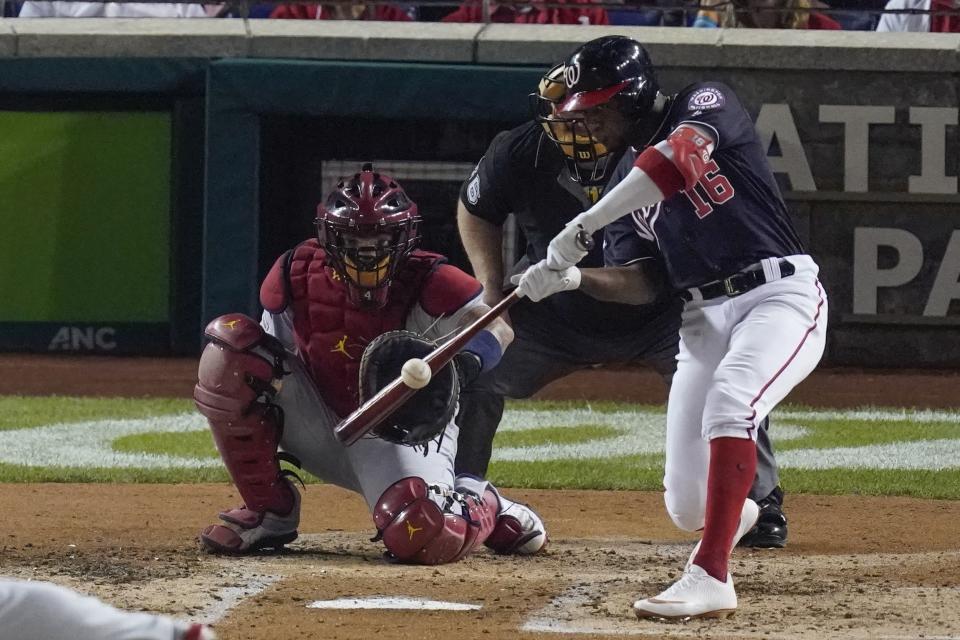 Washington Nationals' Victor Robles hits a single during the third inning of Game 3 of the baseball National League Championship Series against the St. Louis Cardinals Monday, Oct. 14, 2019, in Washington. (AP Photo/Alex Brandon)