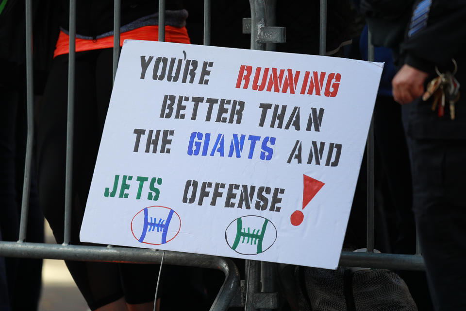 Spectators display a sign as runners race up First Avenue during the 2019 New York City Marathon. (Photo: Gordon Donovan/Yahoo News)