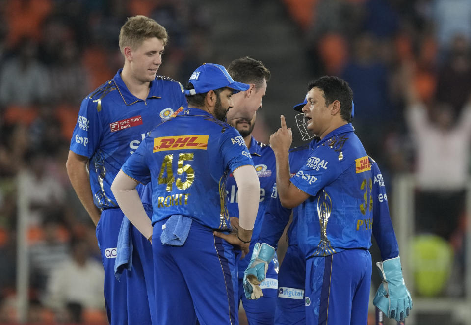 Mumbai Indians' Piyush Chawla celebrates the wicket of Gujrat Titans' Wriddhiman Saha during the Indian Premier League qualifier cricket match between Gujarat Titans and Mumbai Indians in Ahmedabad, India, Friday, May 26, 2023. (AP Photo/Ajit Solanki)