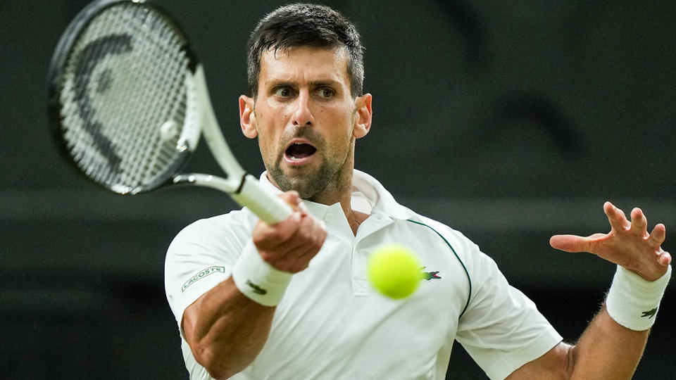 Novak Djokovic concentrates on a return at Wimbledon.