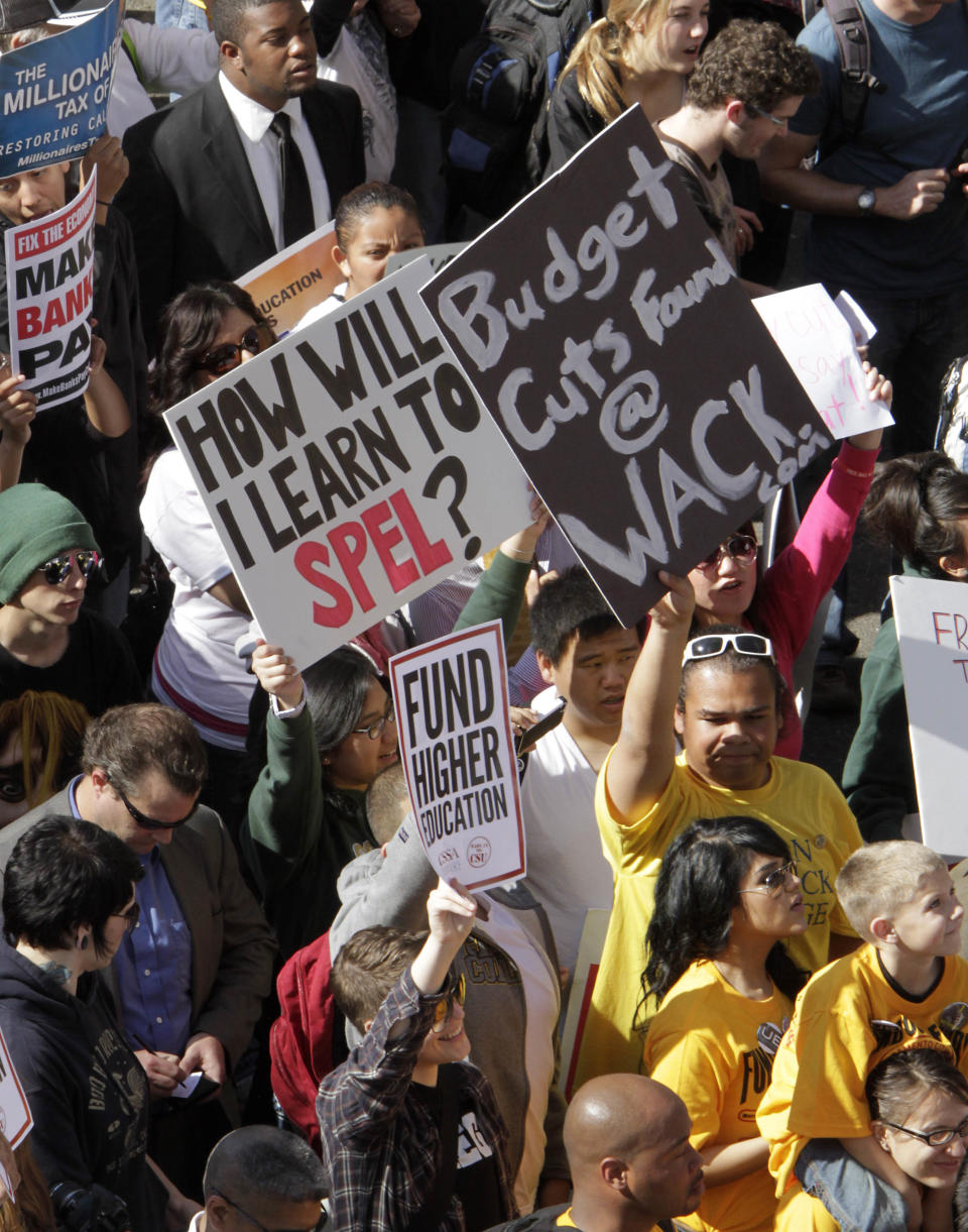 Students march to the Capitol to protest the rising cost of higher education in Sacramento, Calif., Monday, March 5, 2012. As many as 5,000 of college students, teachers and supporters from around the state converged on the Capitol calling on state lawmakers to restore funding for higher education.(AP Photo/Rich Pedroncelli)