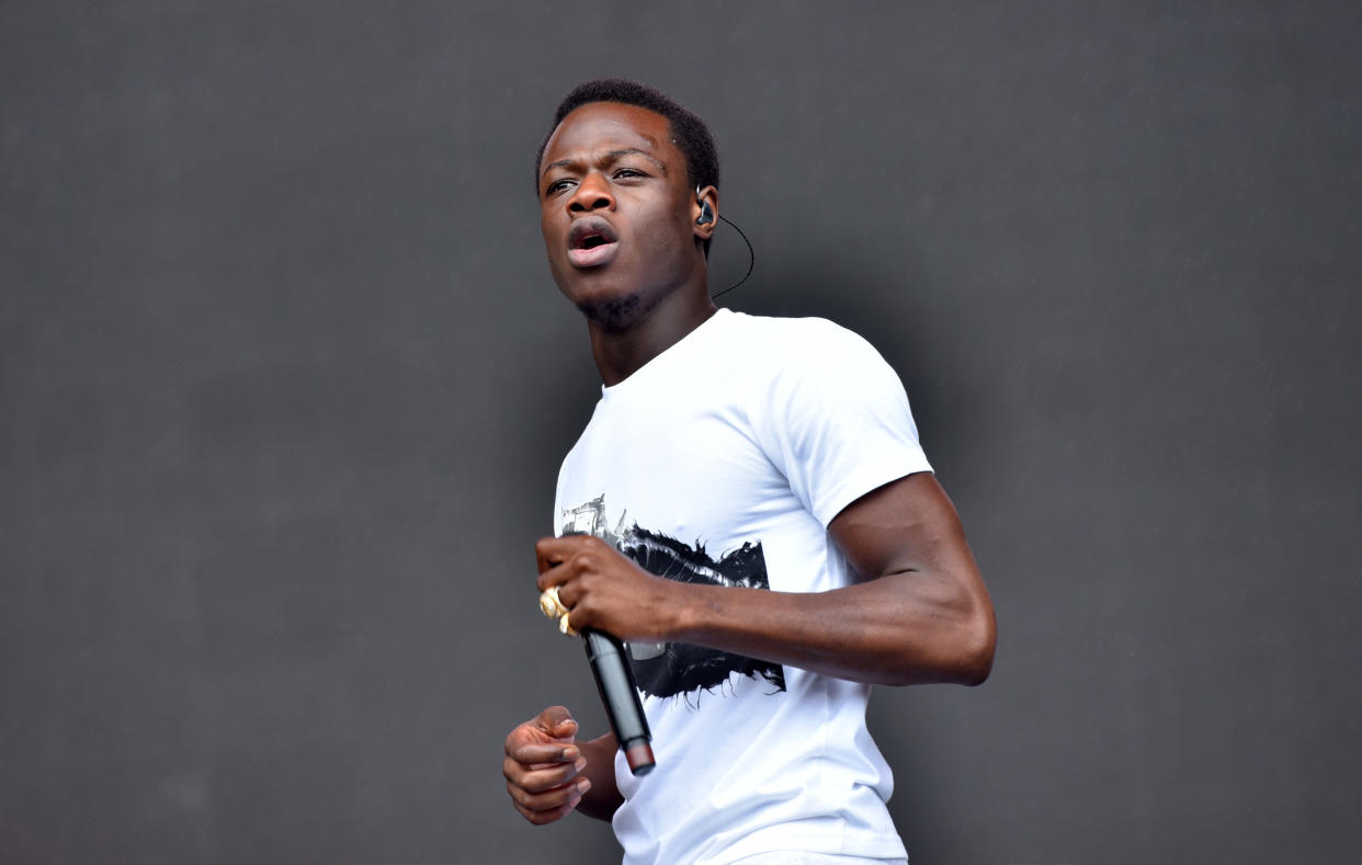 J Hus performs on stage during day three of the Reading Festival August 26, 2018 in Reading, England. (Photo by C Brandon/Redferns)