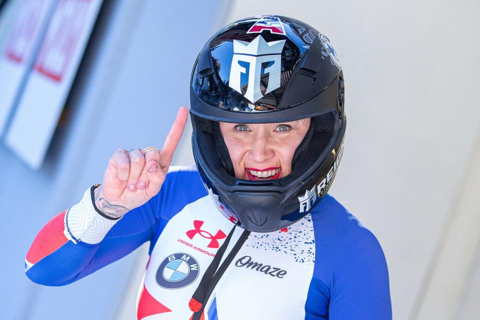Second placed Kaillie Humphries of the US reacts after the second run on the podium after the second run of the women's monobob competition during the IBSF Bob and Skeleton World Cup, the opening event of the Olympic season, at the Olympic sliding track in Innsbruck, Austria, on November 20, 2021. - - Austria OUT (Photo by Peter RINDERER / various sources / AFP) / Austria OUT (Photo by PETER RINDERER/EXPA/AFP via Getty Images)