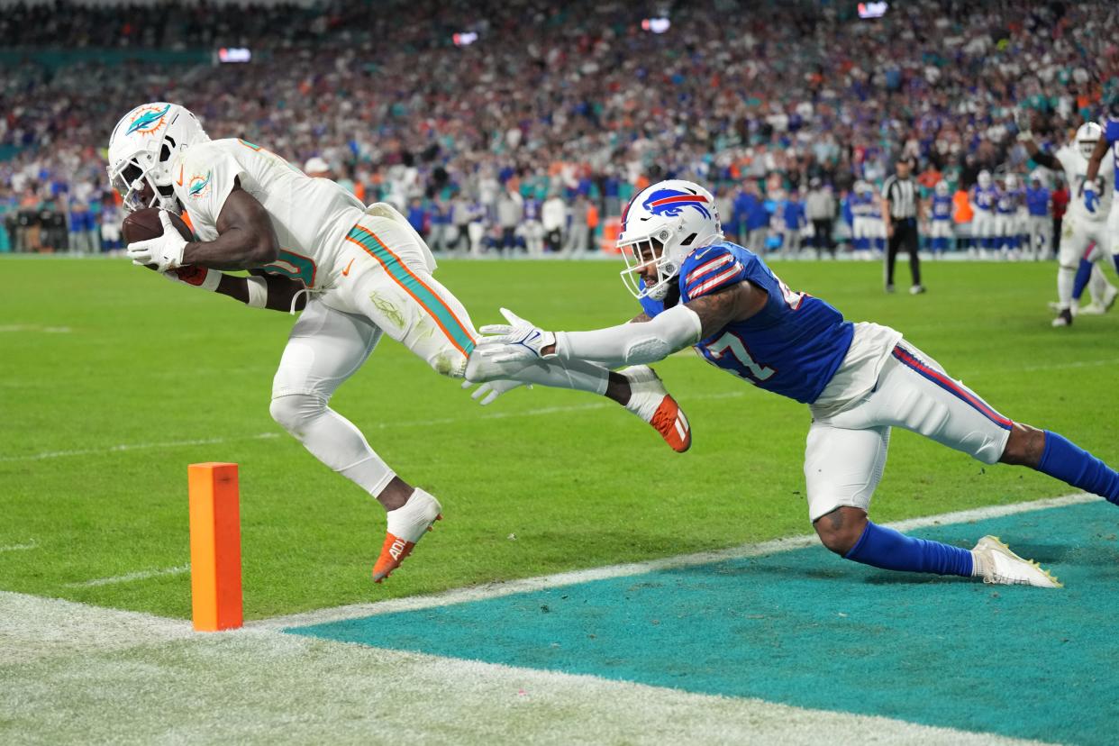 Dolphins receiver Tyreek Hill catches a touchdown pass against Buffalo's Christian Benford.
