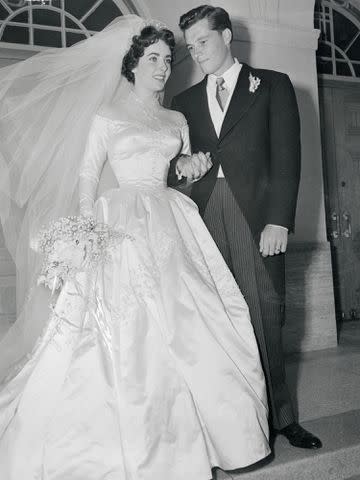 <p>Bettmann</p> Elizabeth Taylor and Conrad "Nicky" Hilton on their wedding day on May 6, 1950.