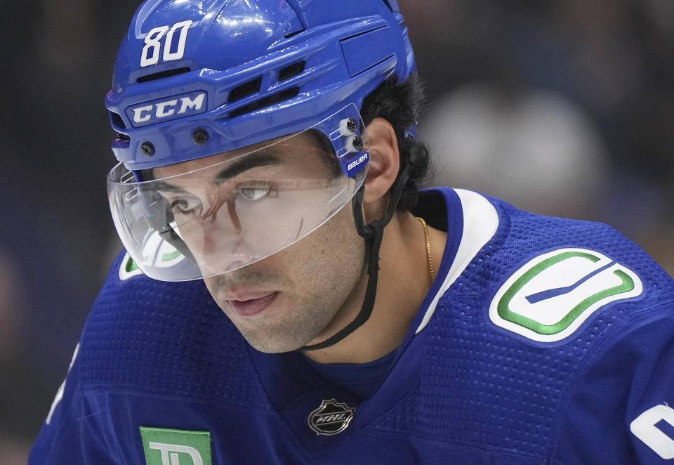 Vancouver Canucks' Arshdeep Bains prepares to take a faceoff during the third period of the team's NHL hockey game against the Pittsburgh Penguins on Tuesday, Feb. 27, 2024, in Vancouver, British Columbia. (Darryl Dyck/The Canadian Press via AP)