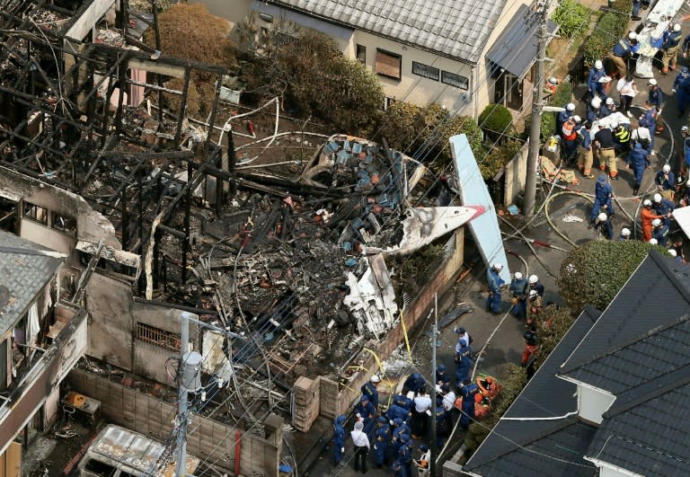 An aerial image showing the destruction after a light plane crashed into a residential area in Tokyo on July 26, 2015