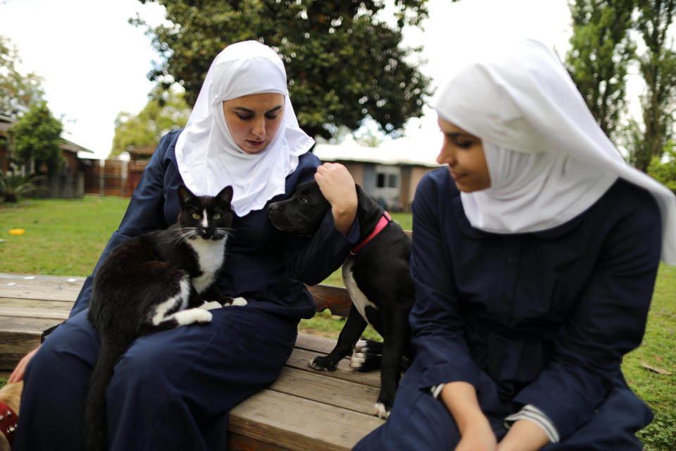 California "weed nun" Desiree Calderon, who goes by the name Sister Freya (L), and India Delgado, who goes by the name Sister Eevee, sit with their pets in the garden at Sisters of the Valley near Merced, California, U.S., April 18, 2017. Picture taken April 18, 2017. REUTERS/Lucy Nicholson