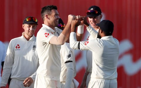 England's James Anderson celebrates with team mates after taking the wicket of West Indies' Jason Holder - Credit: Action Images via Reuters&nbsp;