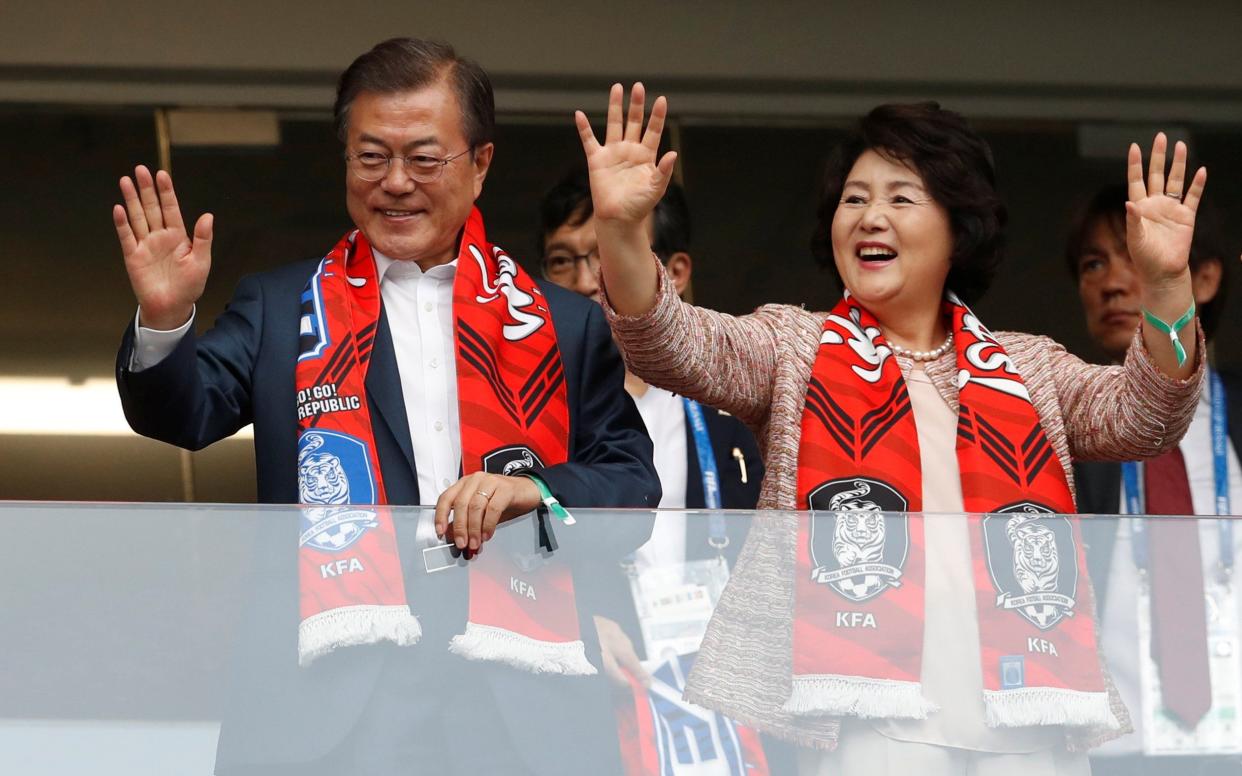 South Korean President Moon Jae-in and his wife, Kim Jung-sook, support the South Korean team at the World Cup in Russia - REUTERS