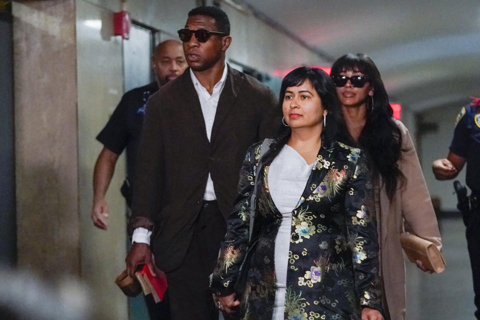 Jonathan Majors, left, and Meagan Good, right, arrive in court for a hearing on his domestic violence case, Tuesday, June 20, 2023, in New York. (AP Photo/Mary Altaffer)