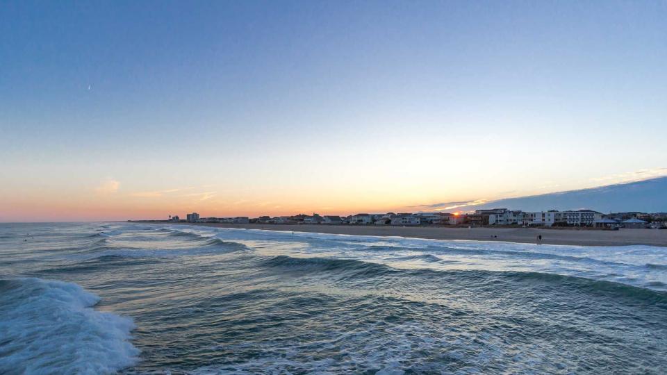 A view of the sunset from the water at Wrightsville Beach