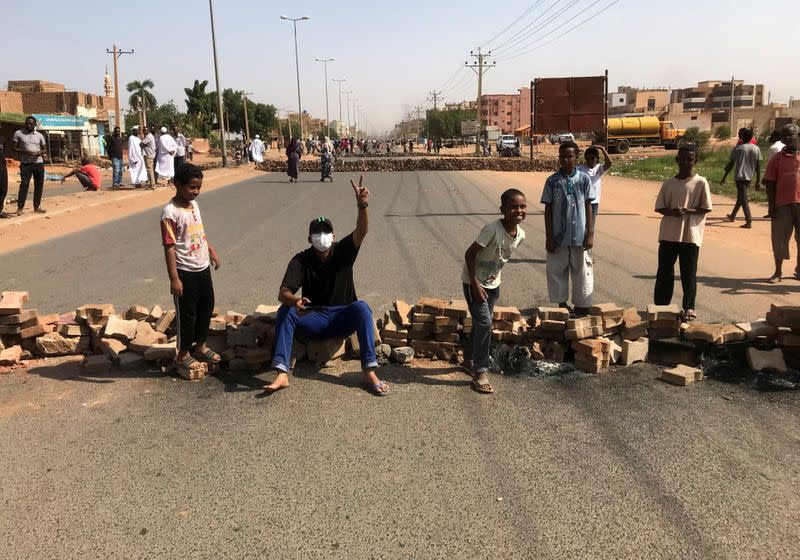 Protesters block a road in Khartoum