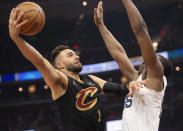 Cleveland Cavaliers' Max Strus (1) shoots over Memphis Grizzlies' Trey Jemison (55) during the first half of an NBA basketball game in Cleveland, Wednesday, April 10, 2024. (AP Photo/Phil Long)