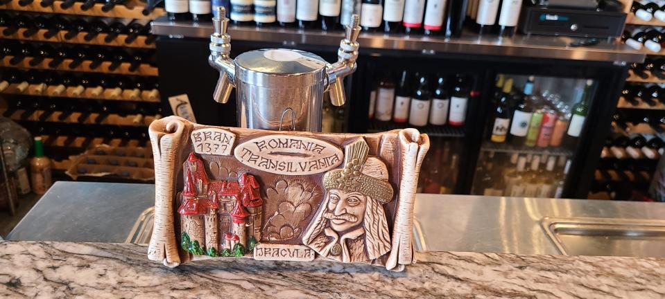 A bar-topping bas-relief depicting Transylvania at Tableside, a new Romanian-American restaurant.