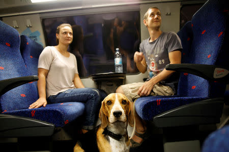 Passengers and a dog travel on Israel's new high-speed rail line from Jerusalem to Ben Gurion International Airport September 25, 2018. REUTERS/Amir Cohen