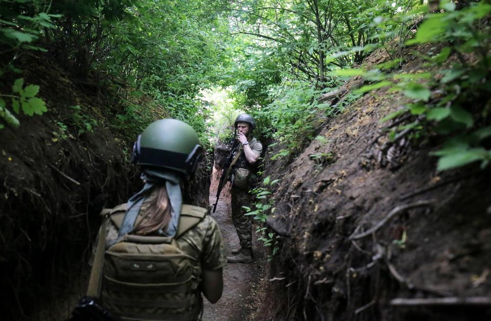 Ukrainian soldiers walk near the village of Zaytseve in the Donetsk region (EPA)