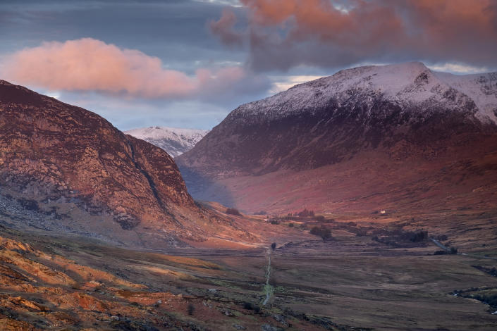 Set your alarm early to catch first light over the Ogwen Valley and snow capped Pen yr Ole Wen in Snowdonia. (Getty Images)