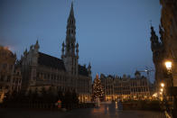 A refuse collector works in the historical Grand Place in Brussels, Sunday, Dec. 20, 2020. The EU and the United Kingdom were still working Sunday on a "last attempt" to clinch a post-Brexit trade deal, with EU fishing rights in British waters the most notable remaining obstacle to avoid a chaotic and costly changeover on New Year. (AP Photo/Virginia Mayo)