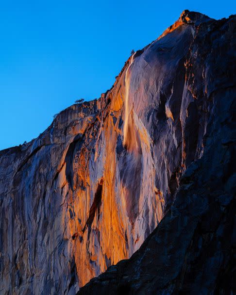 PHOTO: Water flowing off Horsetail Fall glows orange at sunset during in Yosemite National Park, Calif. on Feb. 13, 2023. (Sean Lacsamana/@sean.relacss)