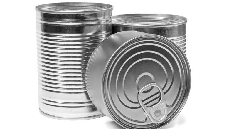 three unlabeled metal cans