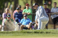 Adam Schenk hits out of the bunker on the fourth hole during the second round of the Valspar Championship golf tournament Friday, March 17, 2023, at Innisbrook in Palm Harbor, Fla. (AP Photo/Mike Carlson)