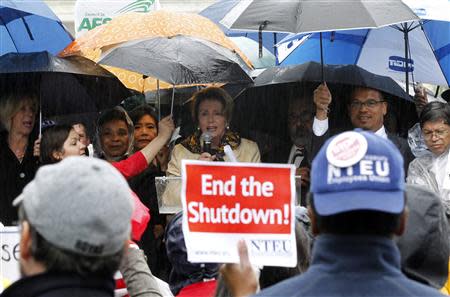 U.S. House Minority Leader Nancy Pelosi (D-CA) addresses protesters calling for an end to the U.S. government shut down on Capitol Hill in Washington, October 10, 2013. REUTERS/Jason Reed