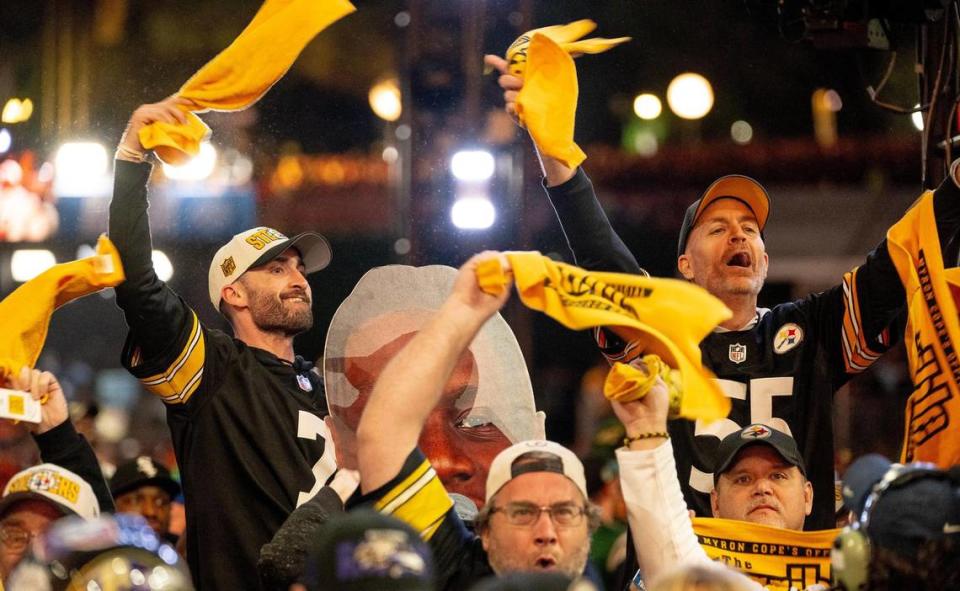 Pittsburgh Steelers fans celebrate their first round pick of Georgia offensive tackle Broderick Jones during the NFL Draft outside of Union Station on Thursday, April 27, 2023, in Kansas City.