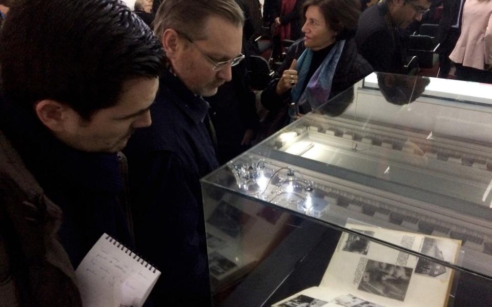 People watch several Nazi documents at Chile's National Archive in Santiago - Credit: AFP