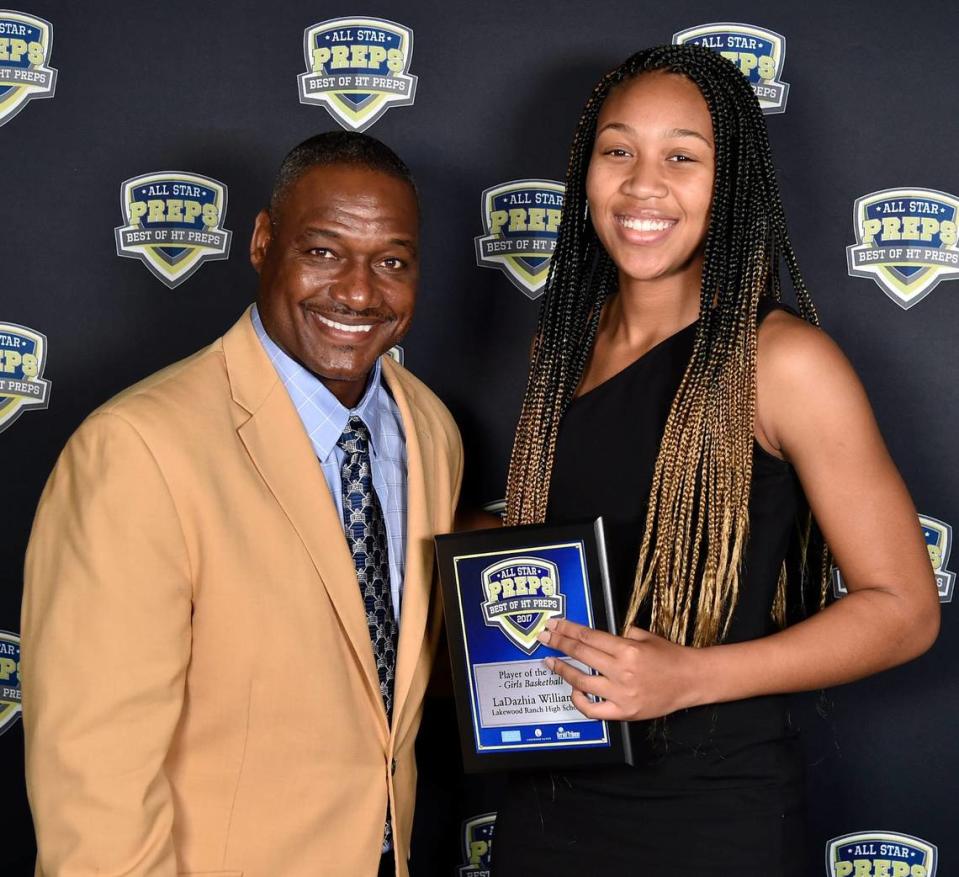 LaDazhia Williams, Lakewood Ranch High School, player of the year girls basketball at the second annual “Best of HT Preps” awards banquet with former Tampa Bay Buccaneers linebacker and Hall of Famer, Derrick Brooks, that was hosted by the Herald-Tribune at Robarts Arena, Tuesday evening May 23, 2017, in Sarasota, Florida. [Herald-Tribune staff photo / Thomas Bender] Sarasota Best Of Preps Awards Banquet Featuring Derrick Brooks