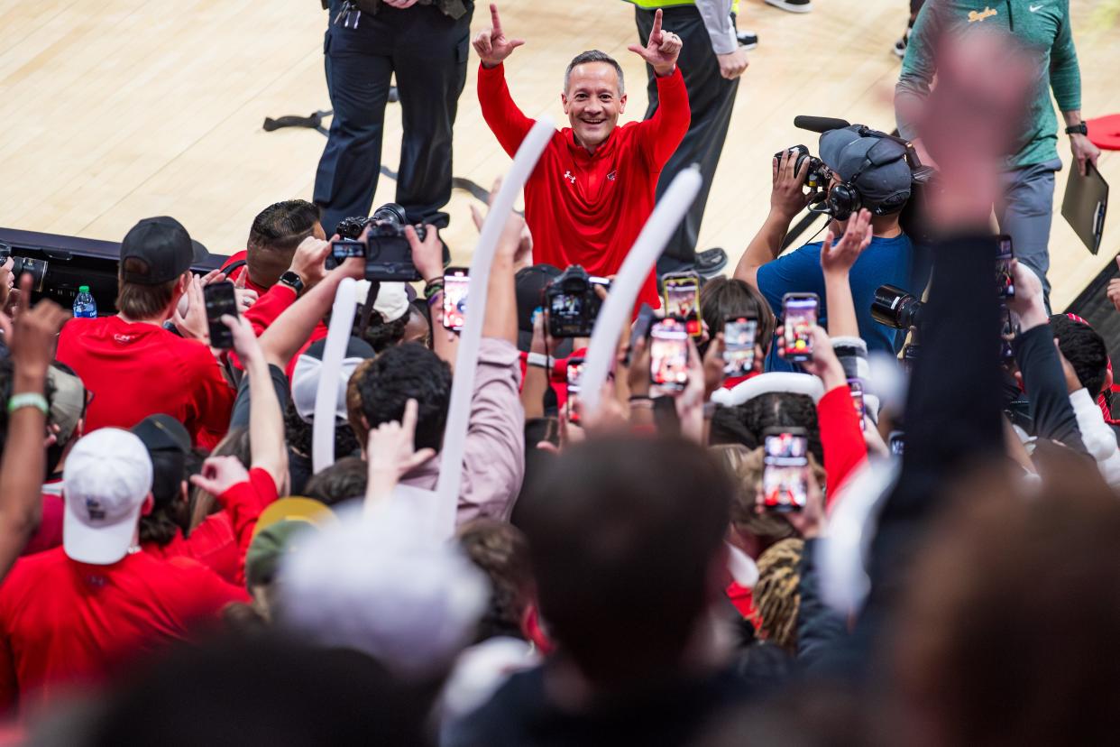 Grant McCasland of Texas Tech celebrates with the student section after the game against Baylor at United Supermarkets Arena on Saturday, March 09, 2024 in Lubbock, Texas.