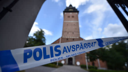 Police tape is pictured at Strangnas Cathedral after thieves stole royal crowns from the 17th century, in Strangnas, Sweden July 31, 2018. Picture taken July 31, 2018. TT News Agency/Pontus Stenberg/via REUTERS
