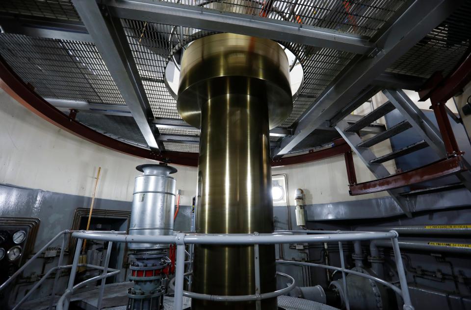 A shaft spinning at more than 100 RPM links a 68,000 horsepower turbine to a generator capable of producing 50,000 kilowatts of electricity at the Table Rock Dam on Wednesday, July 20, 2022.