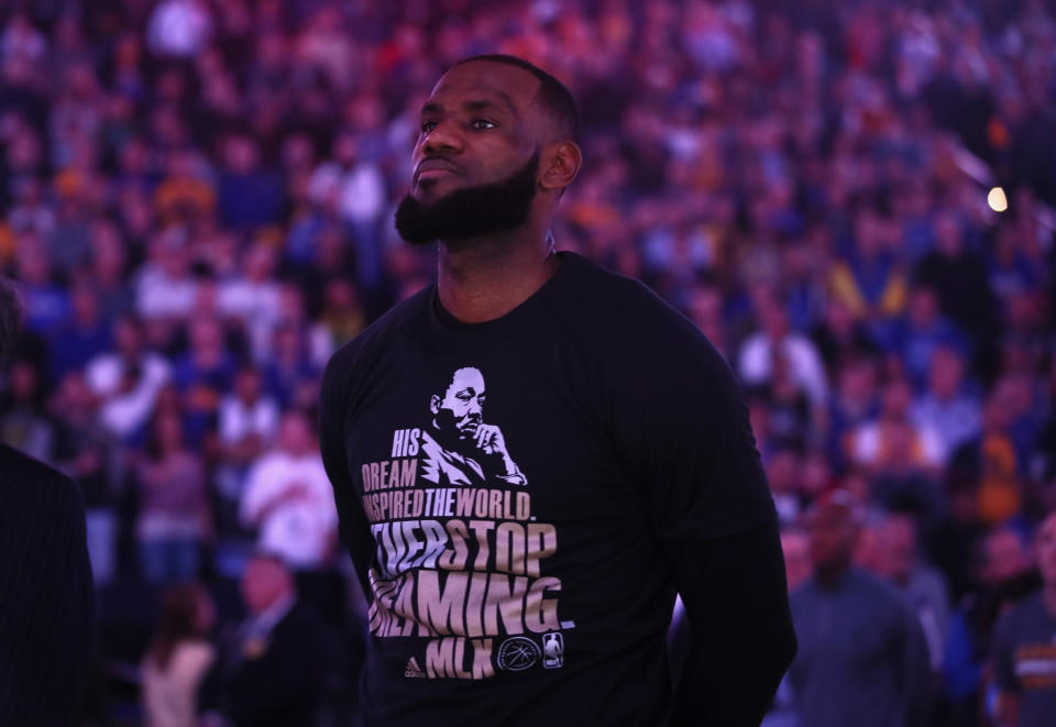 LeBron James of the Cleveland Cavaliers wears a shirt honoring Martin Luther King Jr. during the playing of the national anthem before their game against the Golden State Warriors on Jan. 16, 2017 in Oakland, Calif. (Getty)