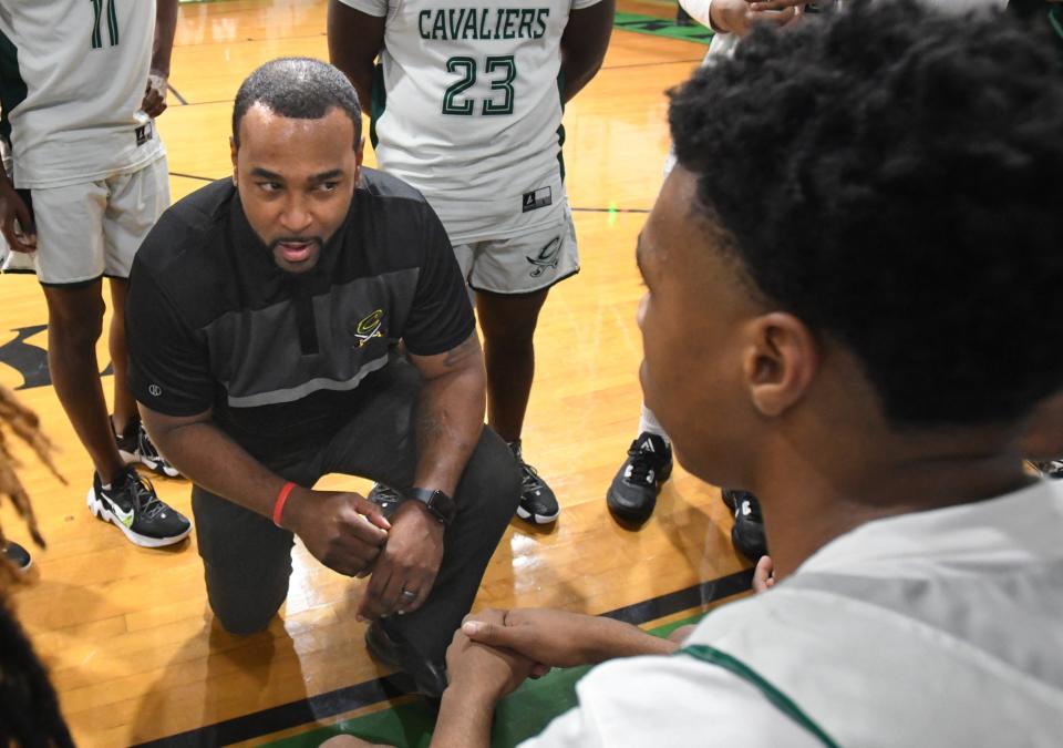 Calvary coach Vic Morris talks to his team during the 2022 Bossier Invitational.