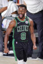 Boston Celtics' Kemba Walker (8) celebrates after a score against the Miami Heat during the second half of an NBA conference final playoff basketball game Friday, Sept. 25, 2020, in Lake Buena Vista, Fla. (AP Photo/Mark J. Terrill)
