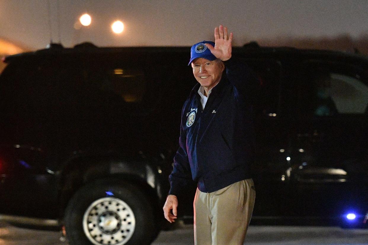 <p>Joe Biden waves upon arrival at Andrews Air Force Base in Maryland on Friday</p> (AFP/Getty)