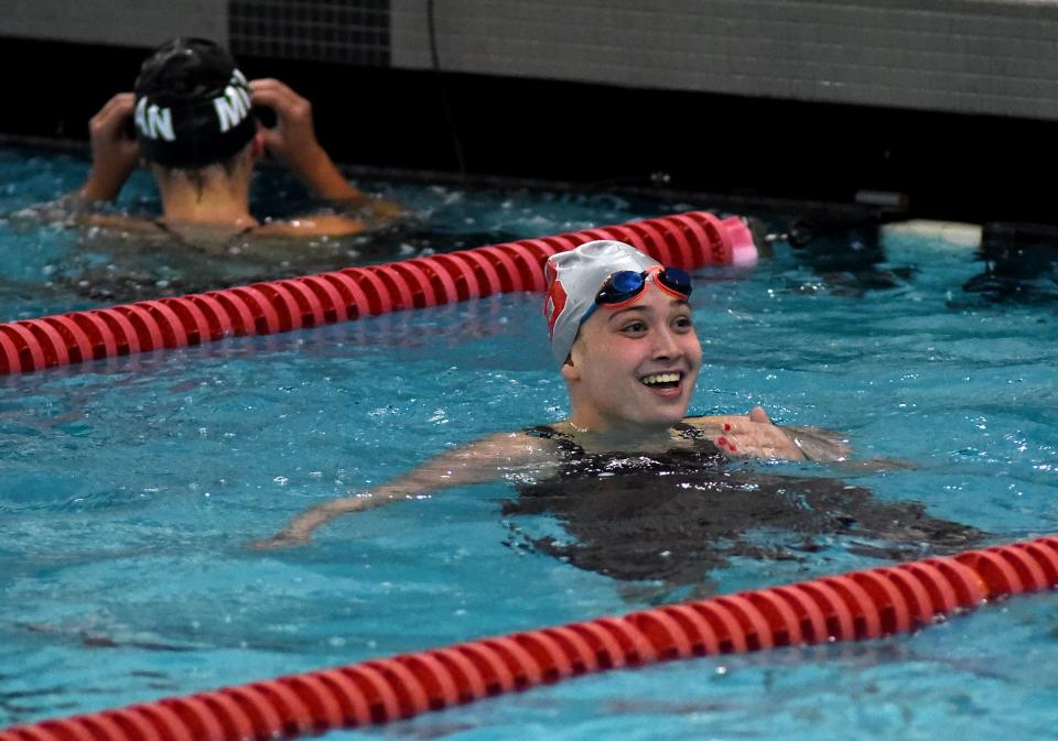 Hannah Smith of Bedford was all smiles after winning the 200-yard freestyle in the Monroe County Swim Finals Saturday.