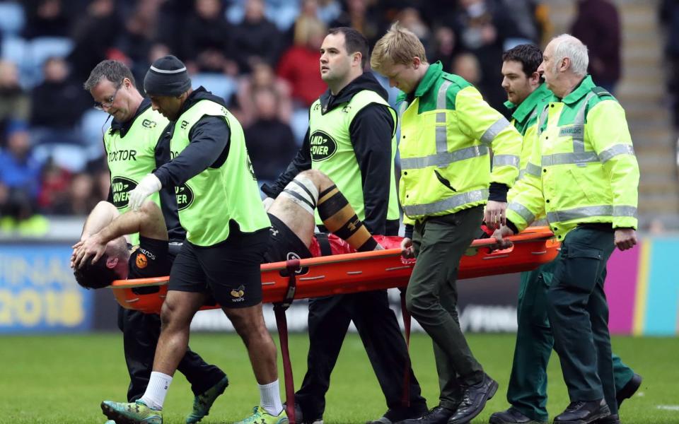 Alex Rieder was carried off on a stretcher during the second half  - PA