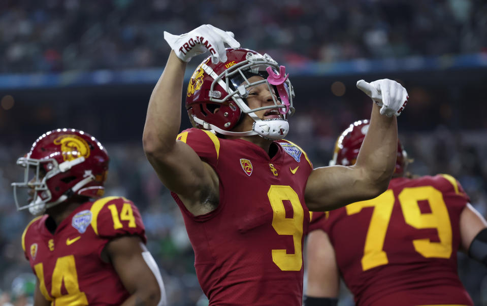 Jan 2, 2023; Arlington, Texas, USA; USC Trojans wide receiver Michael Jackson III (9) reacts after scoring a touchdown during the first quarter against the Tulane Green Wave in the 2023 Cotton Bowl at AT&T Stadium. Mandatory Credit: Kevin Jairaj-USA TODAY Sports