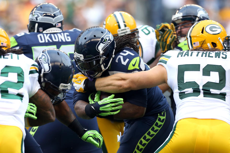 SEATTLE, WA - SEPTEMBER 24: Marshawn Lynch #24 of the Seattle Seahawks runs the ball in the first half against Clay Matthews #52 of the Green Bay Packers at Qwest Field on September 24, 2012 in Seattle, Washington. (Photo by Otto Greule Jr/Getty Images)