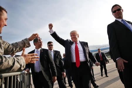 U.S. President Donald Trump reacts as he arrives at Harrisburg international airport, before attending a rally marking his first 100 days in office in Harrisburg, Pennsylvania, U.S. April 29, 2017. REUTERS/Carlos Barria