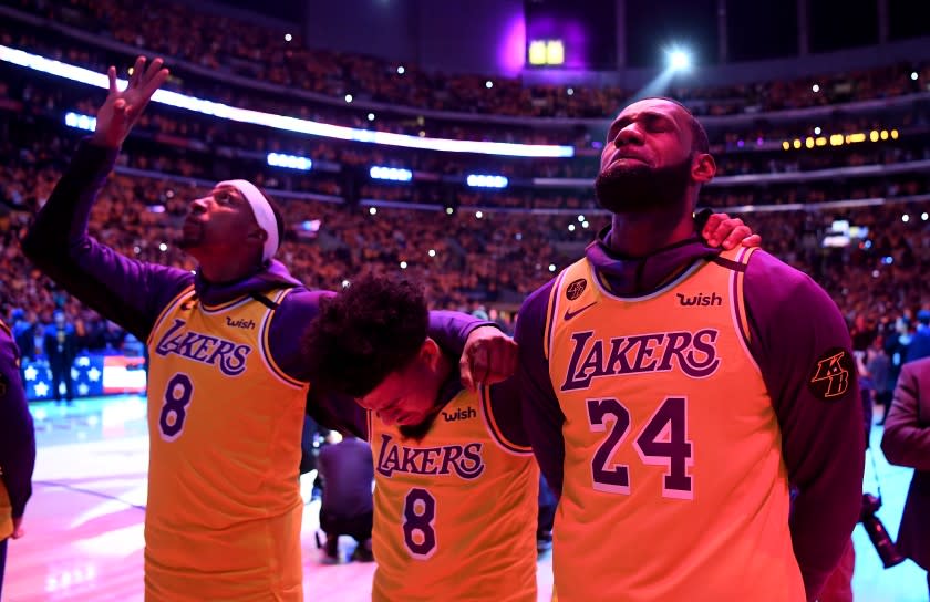 LOS ANGELES, CALIFORNIA JANUARY 31, 2020-From left, Kentavious Caldwell-Pope, Quin Cook, and LeBron James.